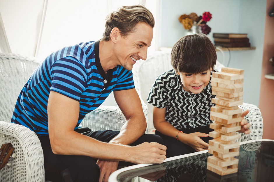 Happy family, father playing wooden blocks with son, cute boy, h