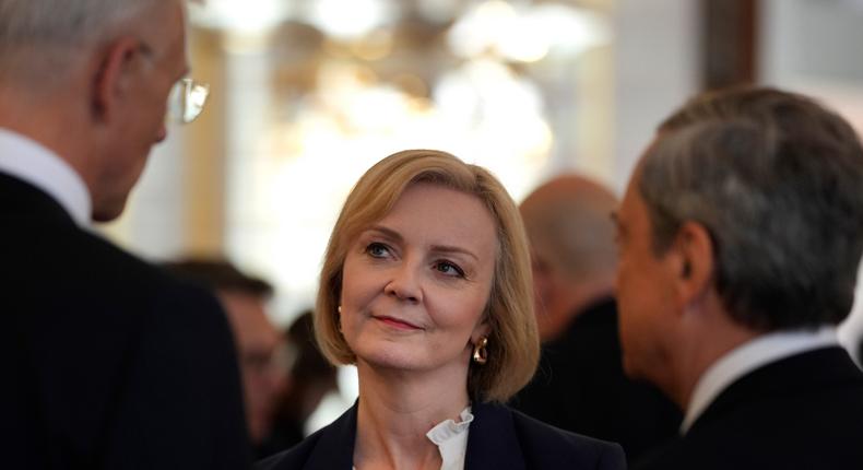 British Prime Minister Liz Truss, center, speaks with Latvia's Prime Minister Krisjanis Karins, left, and Italy's Prime Minister Mario Draghi, right, in Prague, Czech Republic, on Oct 6.AP Photo/Alastair Grant, Pool