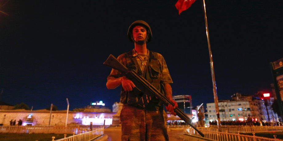 A Turkish military stands guard near the Taksim Square in Istanbul