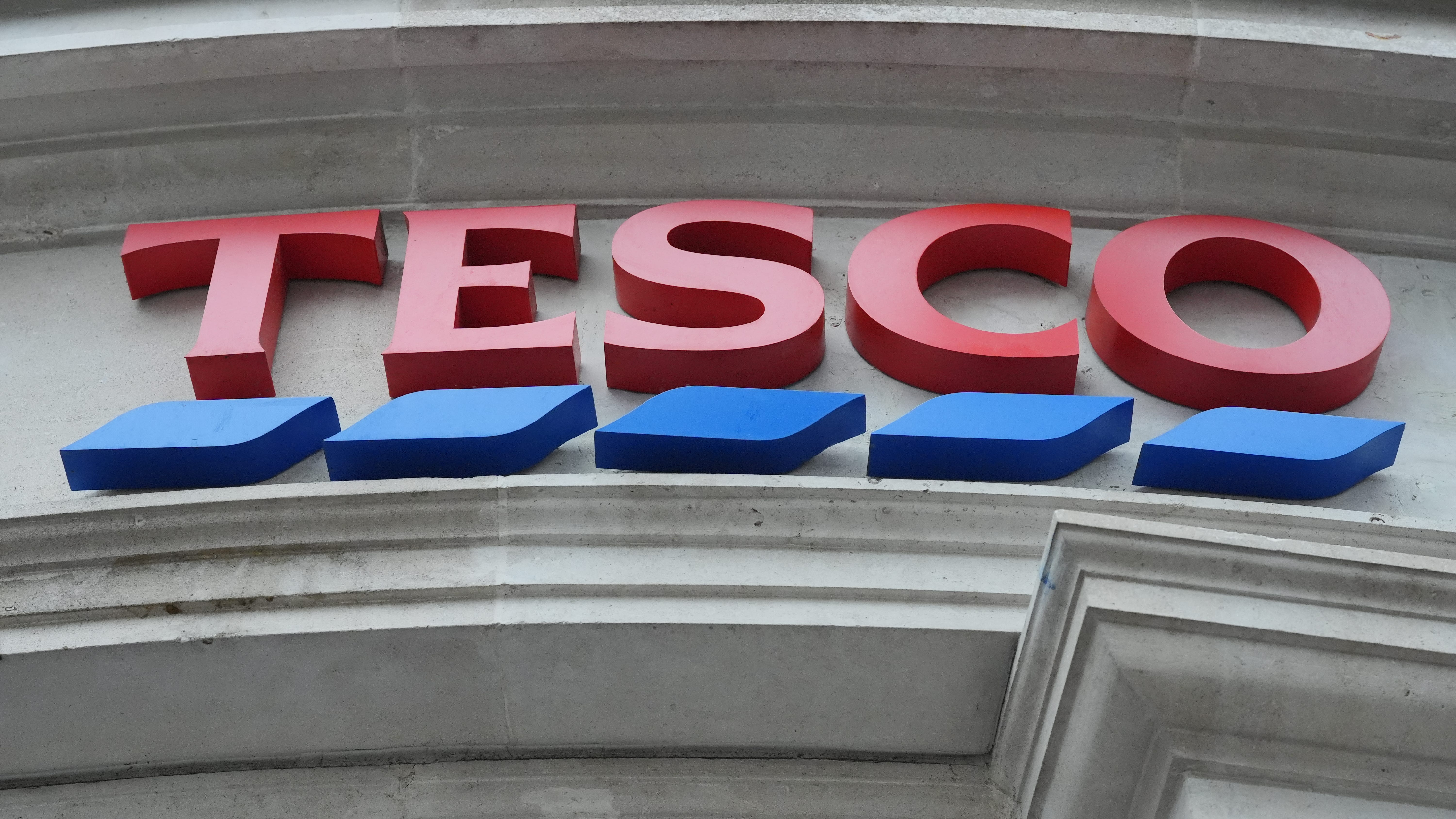 Tesco raises profit forecast - but price war intensifies