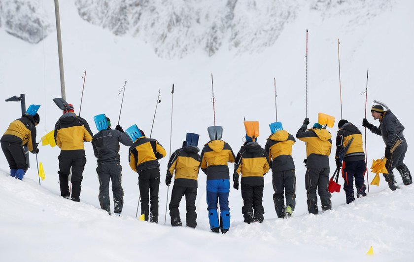 Workers shovel snow out of a restaurant after an avalanche at Santis-Schwaegalp mountain resort