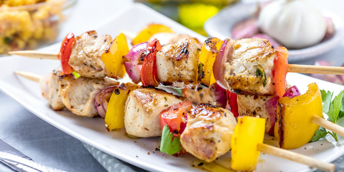 Grilled skewers of vegetables and meat on the Table 