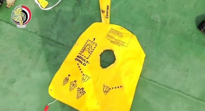 A life jacket, part of recovered debris of the EgyptAir jet that crashed in the Mediterranean Sea, is seen in this still image taken from video on May 21, 2016. 