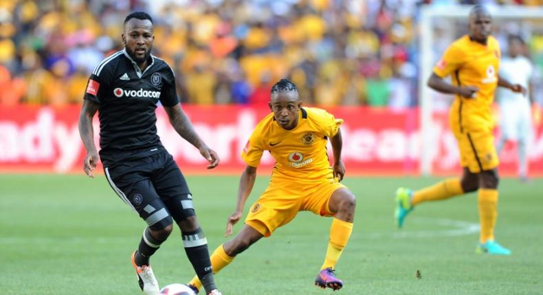 A file photo of Mpho Makola (L) playing for former club Orlando Pirates. He has been banned for six months after shoving a referee