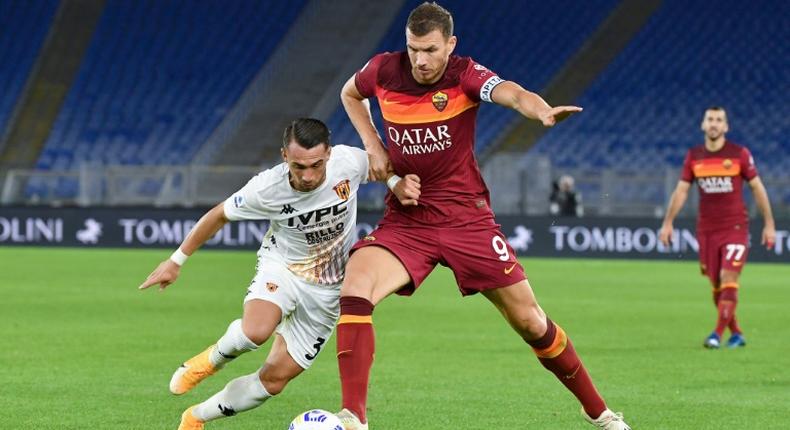 AS Roma forward Edin Dzeko (R) scored twice against Benevento.