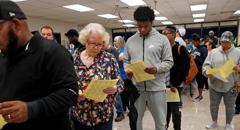 Georgians wait in line to cast their votes in the 2018 U.S. midterm election at a Gwinnett County polling place in Annistown Elementary School in Snellville, Georgia.