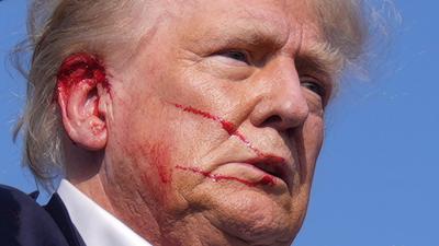 Former President Donald Trump was escorted off-stage with blood on his face after an assassination attempt in Pennsylvania.Evan Vucci