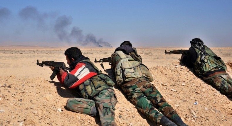 Syrian regime forces fire towards Islamic State group positions as they advance through the desert on February 7, 2017