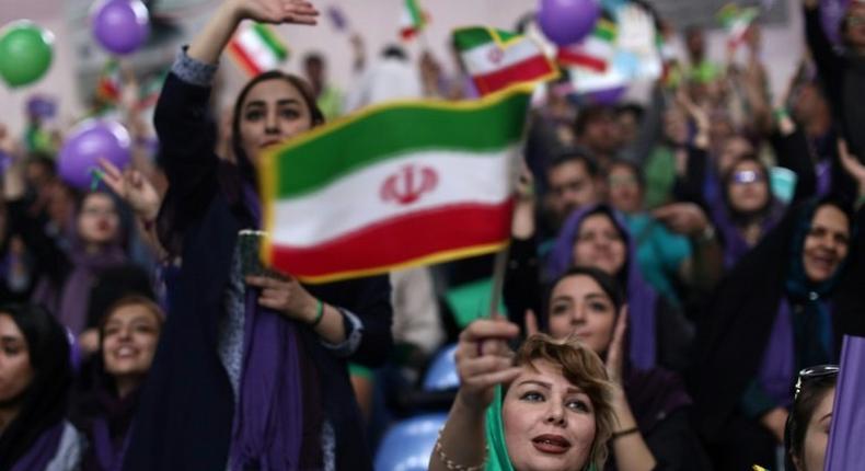 Supporters of incumHassan Rouhani chant slogans during a campaign rally in the northwestern city of Zanjan on May 16, 2017, ahead of the Iranian presidential election on Friday