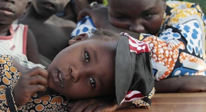 A girl displaced as a result of Boko Haram attack in the northeast region of Nigeria, rests her head on a desk at Maikohi secondary school camp for internally displaced persons (IDP) in Yola, Adamawa State January 13, 2015. 