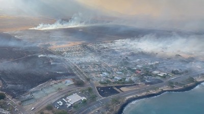 An aerial view as smoke rises from burnt areas amidst wildfires in Maui, Hawaii, U.S., August 9, 2023, in this screenshot taken from a social media video.Vince Carter via REUTERS