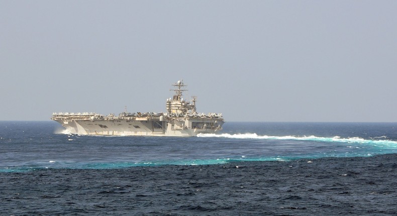 The aircraft carrier USS Abraham Lincoln maneuvers through a turn while underway in the US 5th Fleet area of responsibility.US Navy photo by Capt. Lee Apsley