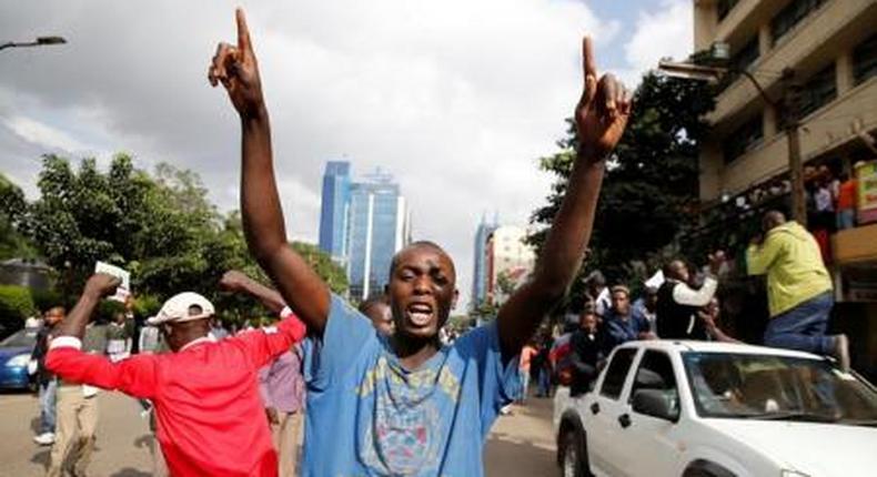 Kenyan opposition Coalition of Reform and Democracy (CORD) supporters protest at the premises hosting the headquarters of Independent Electoral and Boundaries Commission (IEBC) to demand the disbandment of the electoral body ahead of next years election in Nairobi, Kenya, May 23, 2016.
