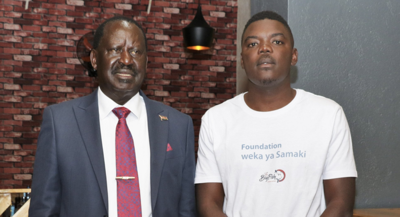 Azimio presidential candidate Raila Odinga alongside 'The Big Fish' proprietor Osumo Brad after visiting the establishment on May 16, 2022