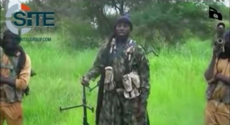 A man purporting to be Boko Haram's leader Abubakar Shekau (C) speaks in this still frame taken from social media video courtesy of SITE Intel Group. SITE INTEL GROUP/ via REUTERS TV