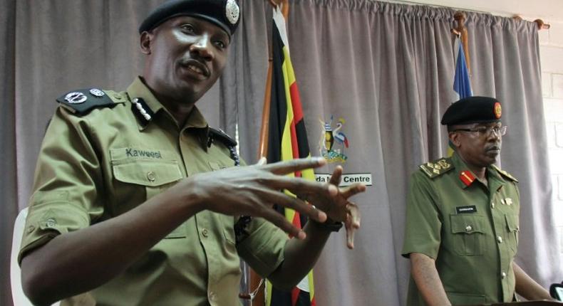 Ugandan police spokesman Andrew Kaweesi (Left) was shot and killed as he left his home in Kampala