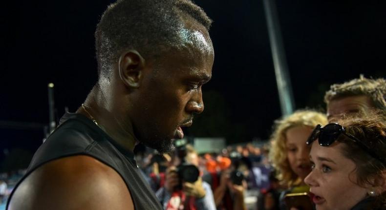 Usain Bolt signs autographs during the Nitro Athletics meet in Melbourne on February 9, 2017