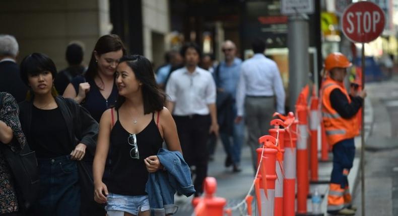 Pedestrians in Sydney's central business district on April 19, 2017. Australia's decision to scrap a visa programme for temporary foreign workers won both praise and criticism