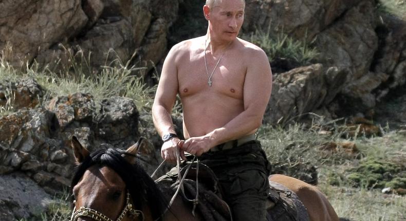 Vladimir Putin rides a horse during his vacation outside the town of Kyzyl in southern Siberia on August 3, 2009.