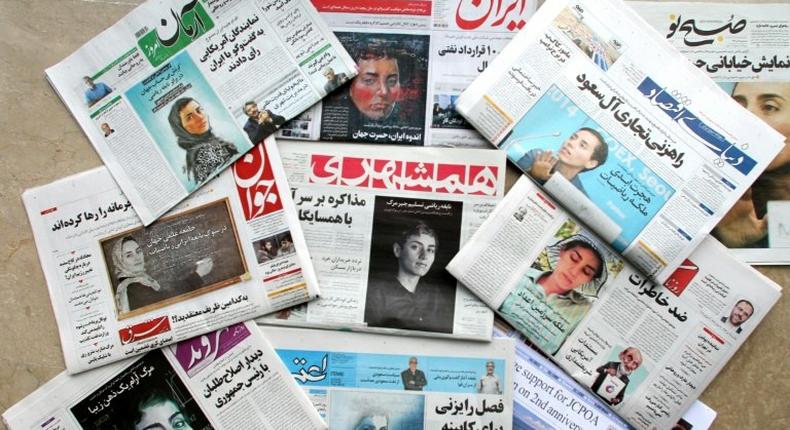 A picture taken in the capital Tehran on July 16, 2017 shows the front pages of Iranian newspapers bearing portraits of mathematician Maryam Mirzakhani, who died of cancer a day earlier