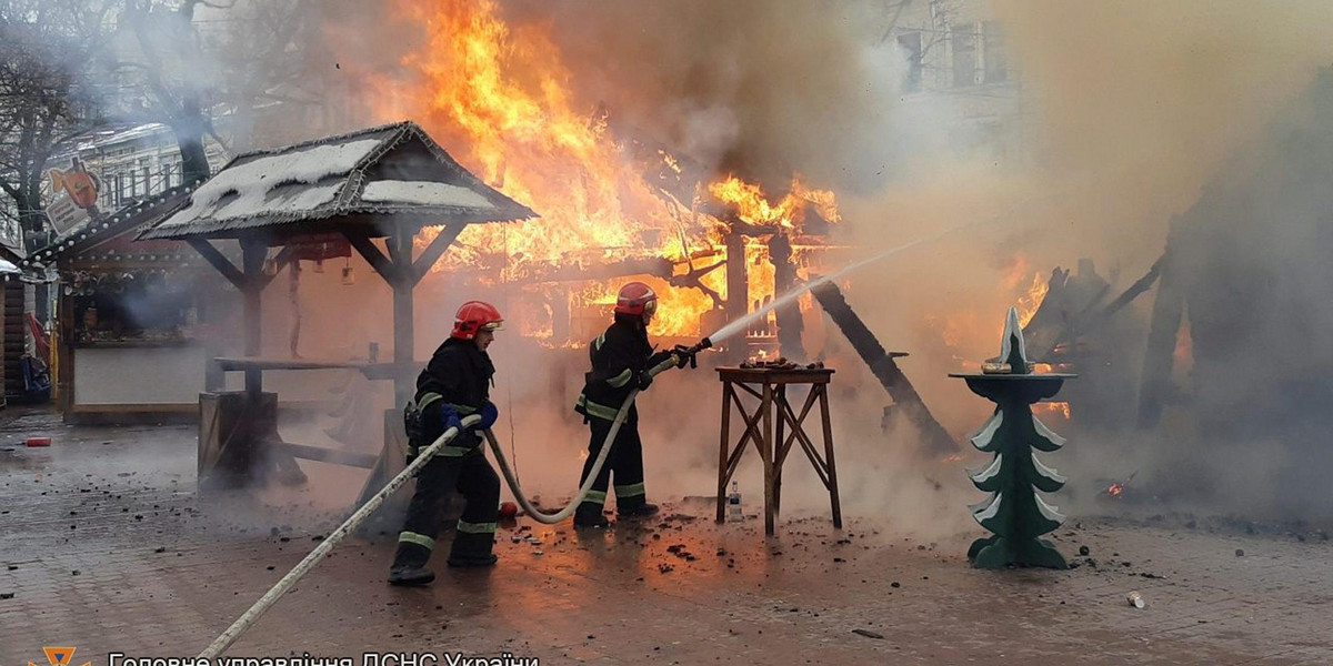 Firefighters extinguish fire at a Christmas fair Lviv