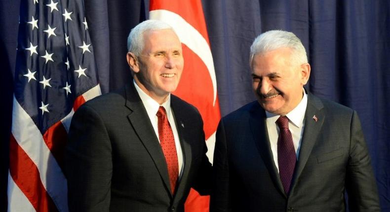 US Vice President Michael Richard Pence (L) and Turkish Prime Minister Binali Yildirim pose for photographers ahead talks at the Munich Security Conference