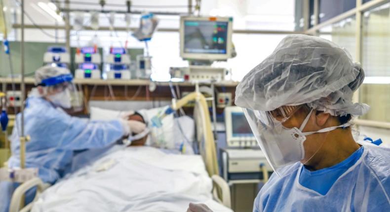 Doctors treat a patient infected with COVID-19, which has pushed the Brazilian health care system to the brink, at the Intensive Care Unit of the Hospital de Clinicas, in Porto Alegre, Brazil, on April 15, 2020