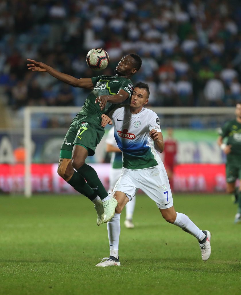 Jaroslaw Jach 7 of Caykur Rizespor and Diafra Sakho 67 of Bursaspor during the Turkish Super League