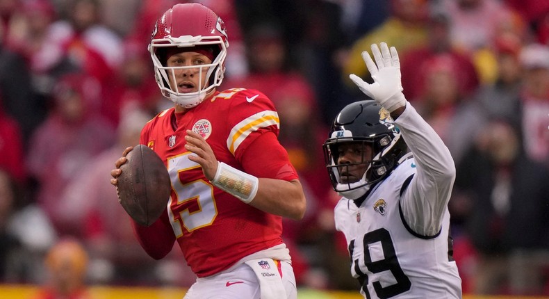 Patrick Mahomes looks to pass while getting pressured by Jacksonville Jaguars defensive end Arden Key.AP Photo/Charlie Riedel