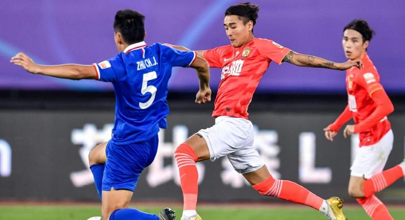 Guangzhou Evergrande's Wei Shihao (C) scored four goals in the first three games of the season