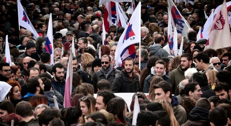 Hundreds of people gather before taking part in a protest march marking a 24-hours general strike in Athens on December 8, 2016