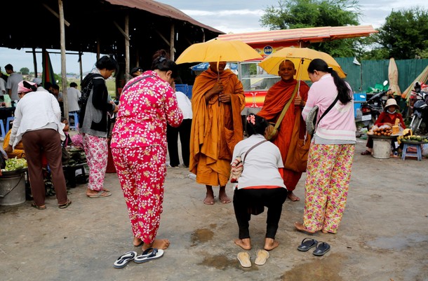 The Wider Image: Cambodian shoe maker has little time for politics