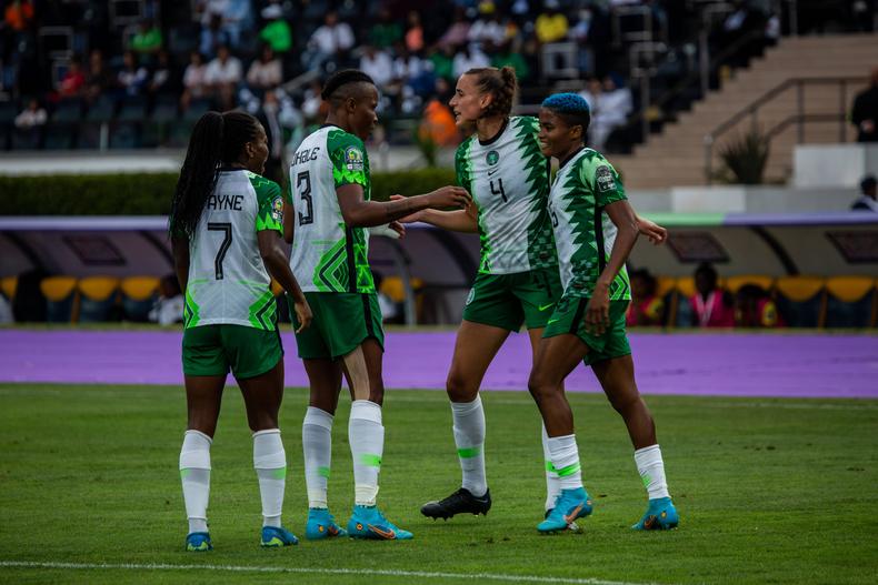 Super Falcons players celebrate a goal