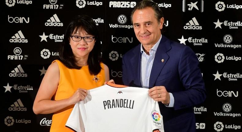 Cesare Prandelli (R) with Valencia's Singaporean President Lay Hoon Chan at the Mestalla stadium in Valencia on October 3, 2016