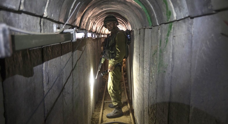 FILE - In this Friday, July 25, 2014 file photo, an Israeli army officer gives journalists a tour of a tunnel allegedly used by Palestinian militants for cross-border attacks, at the Israel-Gaza Border.AP Photo/Jack Guez, Pool, File