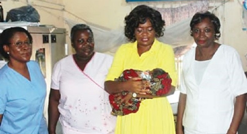 Dr. Inyang Asibong with one of the rescued babies