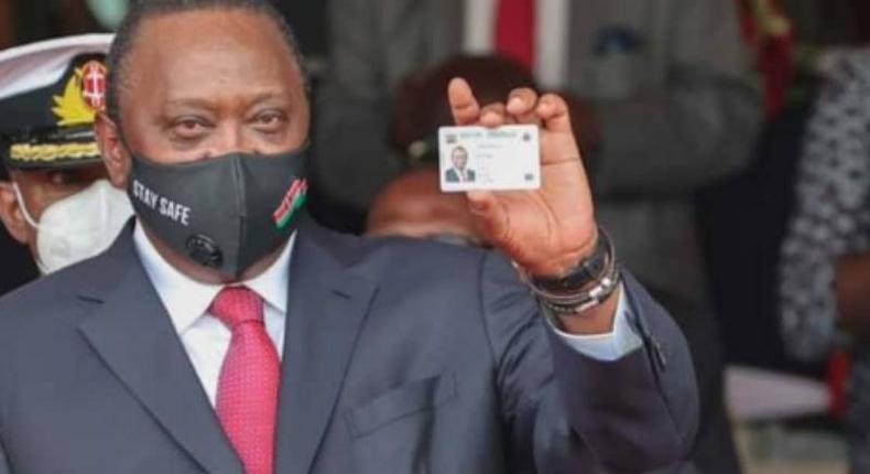 President Uhuru Kenyatta showing his Huduma Namba card after receiving it in December 2020