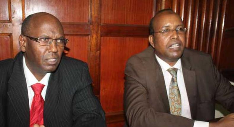 Former NYS Deputy Director General Adan Harakhe (right) with former Devolution and Planning ministry administrator Hassan Noor Hassan in a Nairobi court on November 28, 2016.