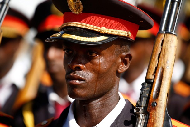 A member of Ethiopia's military reacts as he stands in their parade during the 121st celebration of 