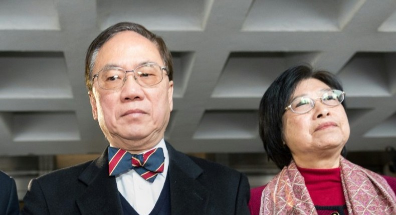 Wearing his customary suit and bow tie, former Hong Kong chief executive Donald Tsang (L) is set to hear the High Court jury's verdict in his corruption trial