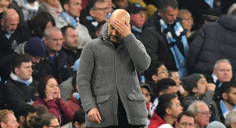 Suffering: Manchester City manager Pep Guardiola reacts after his side's exit