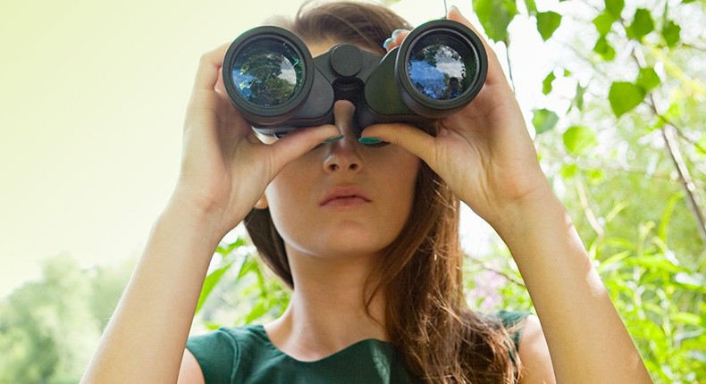 woman spying on partner