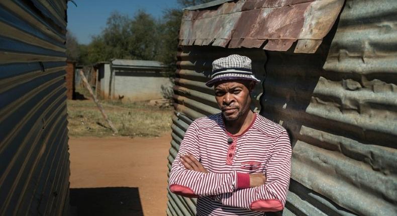 Mohlaudi Mohlaudi stands outside his house in Marikana, where in 2012 police opened fire on striking platinum workers, killing 34 miners and wounding dozens more 