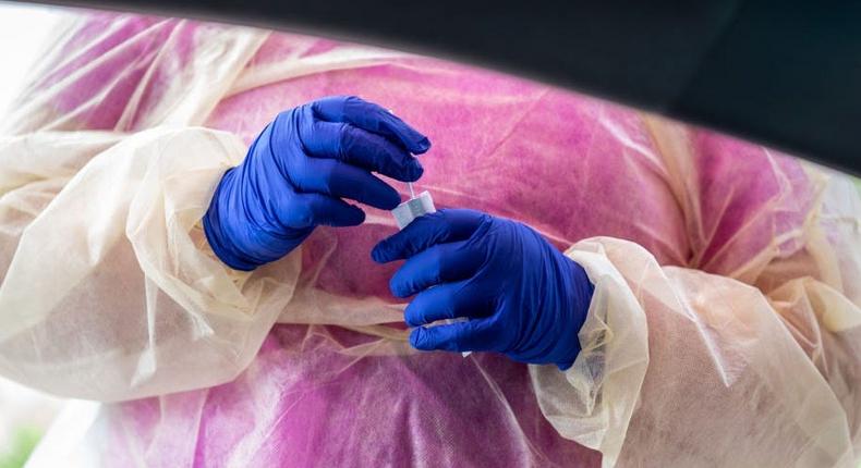 File image of a medic collecting samples during a Covid-19 test