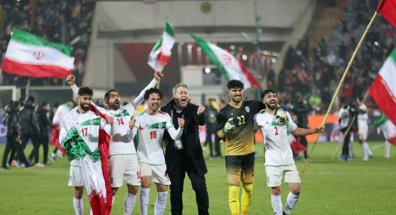 Iran's players celebrate after qualifying for the 2022 World Cup after their 1-0 win over Iraq -- female fans said the presence of women in the stands definitely had an impact on the result Creator: Atta KENARE