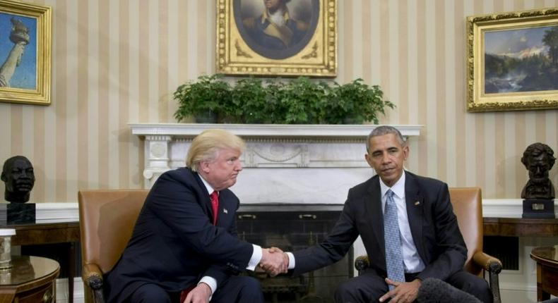 US President Barack Obama shakes hands with President-elect Donald Trump in the Oval Office at the White House on November 10, 2016