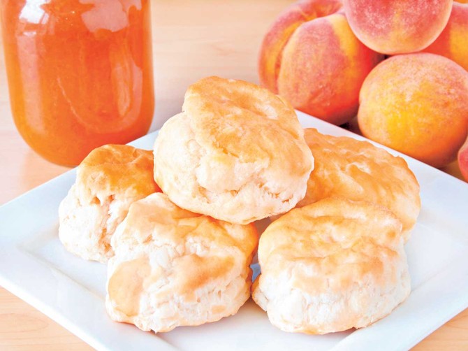 9504_stock-photo-fresh-home-made-biscuits-stacked-on-a-white-plate-with-home-made-peach-preserves-in-the-background-shutterstock_36338914