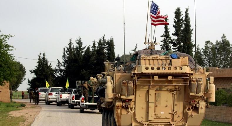 US forces accompanied by Kurdish People's Protection Units fighters near the northern Syrian village of Darbasiyah on the border with Turkey on April 28, 2017