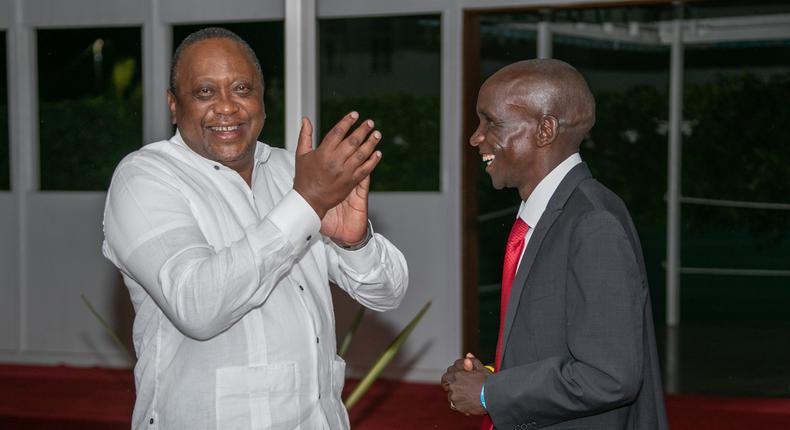 President Uhuru Kenyatta with Eliud Kipchoge at a State House cocktail party in Nairobi on September 8, 2021