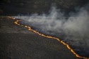 An aerial view from a helicopter shows fire on the ground in northern Ukraine